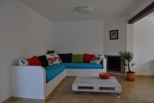 a living room with a couch and a coffee table at Casa Maravilla in Mazarrón