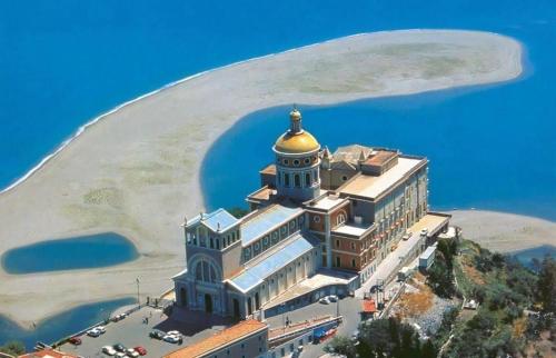 a large building with a gold dome on top of it at Terrazza Sul Mare in Terme Vigliatore