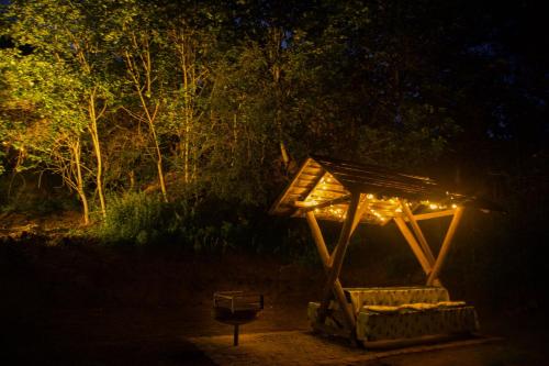 a wooden structure with lights in the dark at Ferienhaus Für 2 Personen Ca 35 M Sup2 In Seegebiet Mansfelder Land Seeburg, Sachsen Anhalt Mansfelder Land in Seeburg