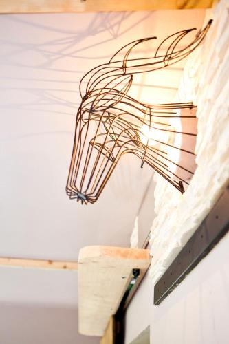 a wire light fixture hanging from a ceiling at Cottage Number9 in Leiben