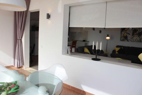 a living room with a glass table and a couch at Großes Modernes Ferienapartment Villa Atlantico in La Pared
