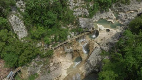 an aerial view of a river on a rocky mountain at Stone House Kotli in Kotli