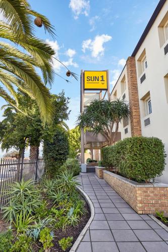 a sign that reads sun in front of a building at SUN1 Parow Cape Town in Avondale