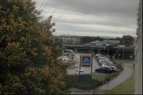 a bunch of cars parked in a parking lot at 2 Bed & 2 Bath-Flat-Driving Distance to Edinburgh in Uphall