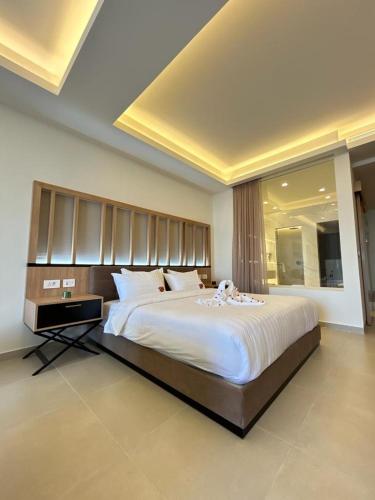 a large bedroom with a large bed in a room at Hotel Saint Georges Beirut in Al Marfaʼ