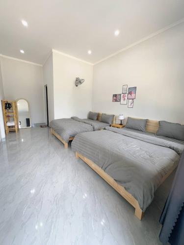 Ένα ή περισσότερα κρεβάτια σε δωμάτιο στο Homestay Nhà Của Gạo