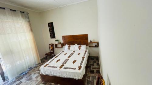 a bedroom with a large bed in a room at Bete Selam in Bahir Dar