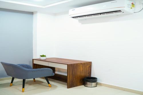 an office with a desk and a printer and a chair at Housr 78 Madhapur Hitech City Near Yashoda Hospital in Hyderabad
