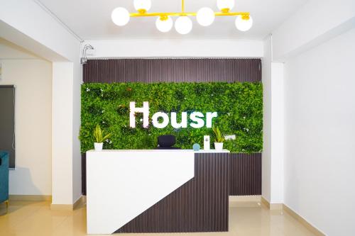 a sign for a house in a store lobby at Housr 78 Madhapur Hitech City Near Yashoda Hospital in Hyderabad