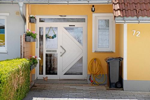 a white door on the side of a house at Fewo Furtwangen in Furtwangen
