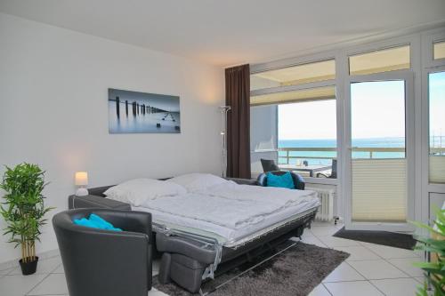 Ένα ή περισσότερα κρεβάτια σε δωμάτιο στο Grömitz- Center II App 37 inkl WLAN