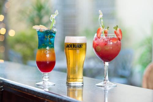 three different types of drinks on a table at The Portswood Hotel in Cape Town