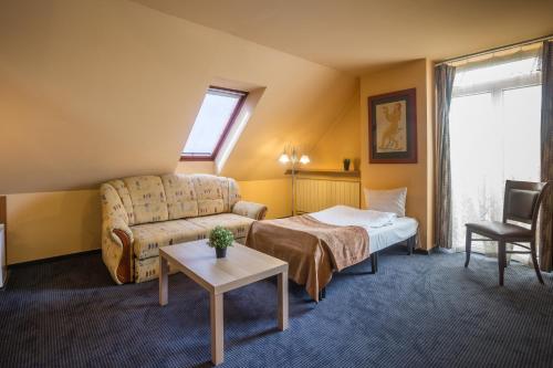 Postel nebo postele na pokoji v ubytování Hotel Luna Budapest