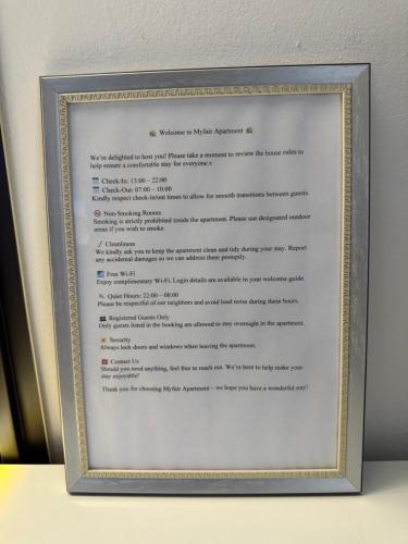 a picture of a menu in a frame at Mayfair Apartment Ksamil in Ksamil