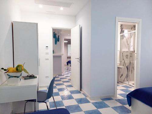 a living room with a checkered floor at Damè Mare in Maiori