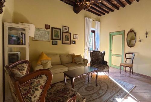 a living room with a couch and a table at Santa Maria apartments in Todi