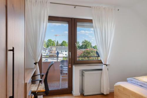 Postel nebo postele na pokoji v ubytování Ferienwohnung Markelfingen