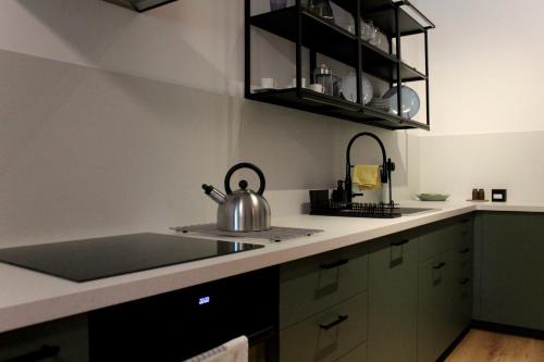 a kitchen with a tea kettle on the counter at Apartmány Abacie in Nový Jičín