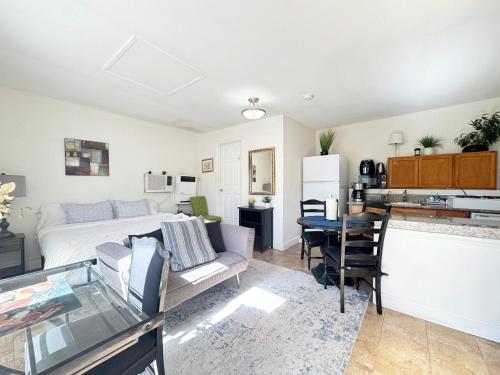 a living room with a bed and a table at Cozy and comfortable Studio - Hal2-UC in Los Angeles