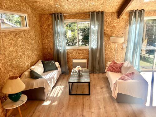 Posezení v ubytování Chalet Bois Surf 5 min à pieds de l'océan