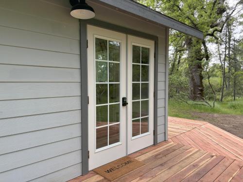 a door on a porch of a house at The Mountains are Calling - Private, Guesthouse Retreat near Yosemite in Ahwahnee