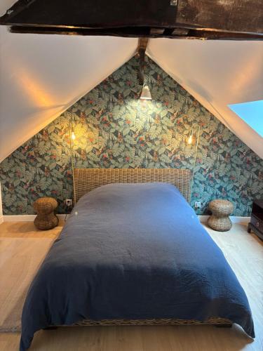 En eller flere senge i et værelse på Le Cottage de Cardunel