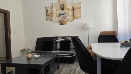 a living room with a couch and a table at Appartement Sélestat centre in Sélestat