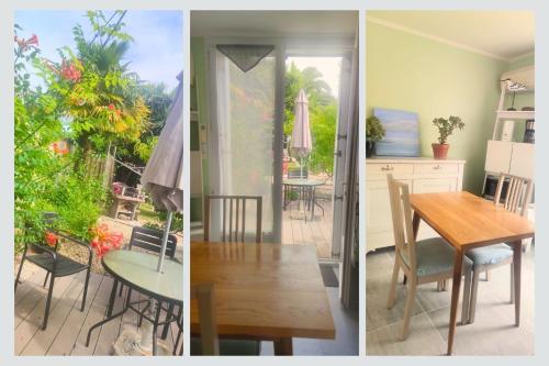 une cuisine et une salle à manger avec une table et des chaises dans l'établissement Cap sur La Flotte ,Maisons centre-ville Jardin mélange art fleurs, à La Flotte