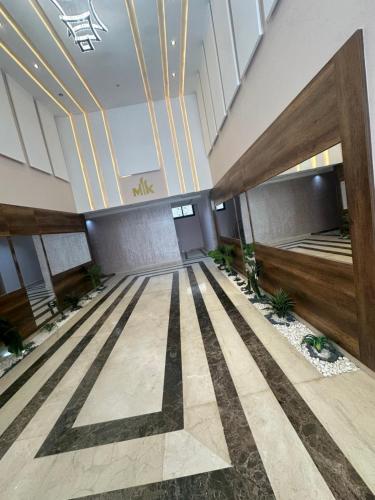 a lobby of a building with a large room at Appartement Mlk in Nador