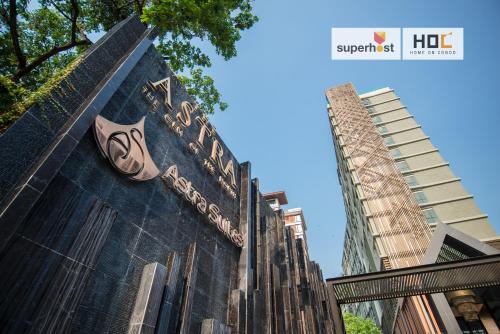 a sign on the side of a building at Modern 2-Bedroom Condo with Pool in Chiang Mai