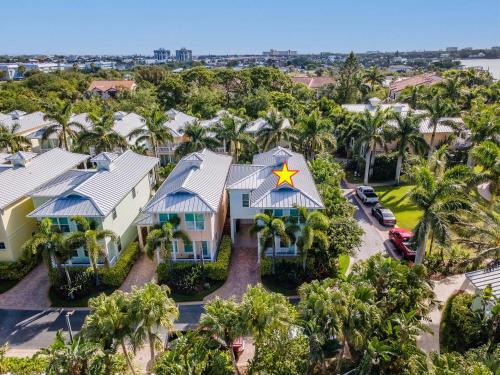 an aerial view of a house with a yellow star on the roof at Outriggers 18- Happy Daze in New Smyrna Beach