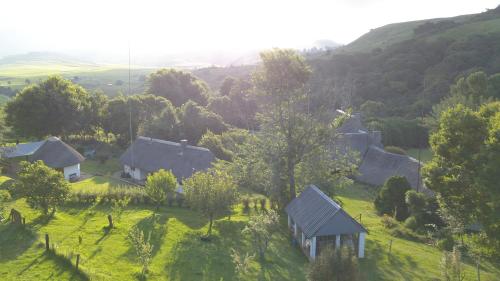 an aerial view of a house on a green hill at Bramleigh Farm in Nottingham Road