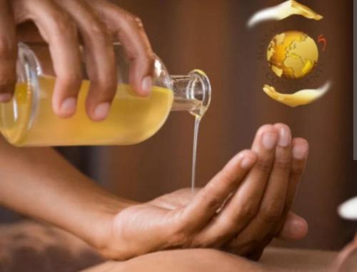 a person is holding a bottle of honey at Domaine de Lithos in Fossemagne