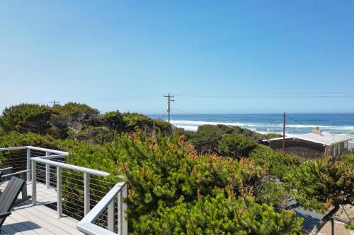 a view of the ocean from the deck of a house at Loki's Kingdom in Rockaway Beach