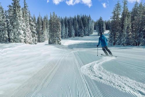 a person is skiing down a snow covered slope at Northstar Nook in Edwards