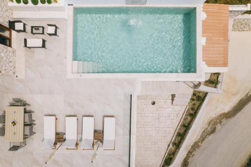 an overhead view of a swimming pool in a house at Angel Villa Zante in Lithakia