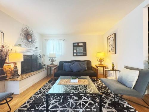a living room with a couch and a fireplace at Charming 3BR House - Hal-UC in Los Angeles