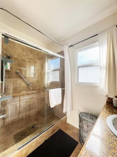 a bathroom with a shower and a sink at Charming 3BR House - Hal-UC in Los Angeles