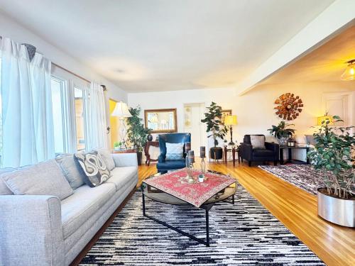 a living room with a couch and a table at Charming 3BR House - Hal-UC in Los Angeles