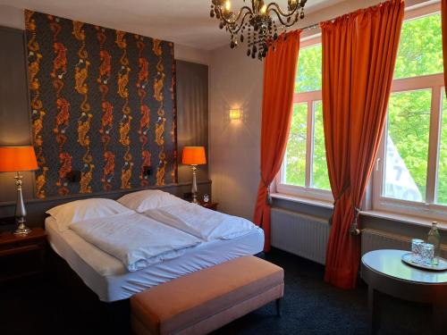 Postel nebo postele na pokoji v ubytování Krögers Hotel