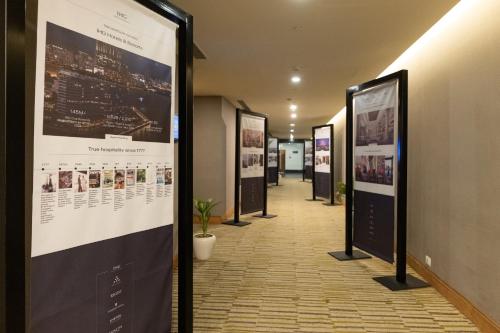 a hallway with posters on the walls of a building at Crowne Plaza Today Gurugram by IHG in Gurgaon