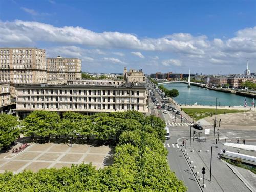 a view of a city with a river and buildings at Best Western ARThotel in Le Havre