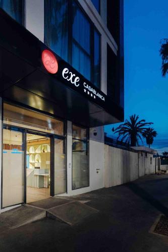 a building with a cafe sign on the side of it at Exe Casablanca in Casablanca