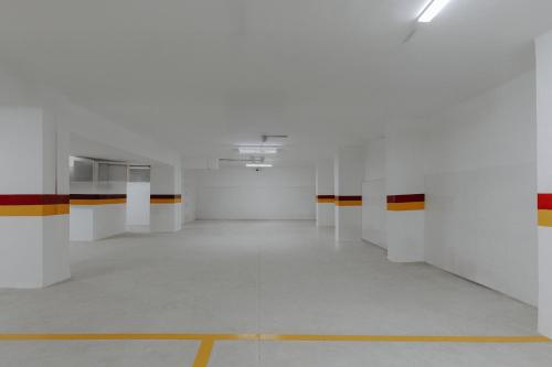 an empty white room with a yellow line on the floor at Exe Casablanca in Casablanca