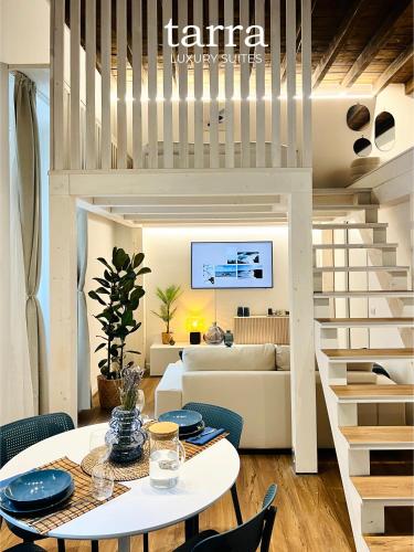 a living room with a table and a couch at Tarra Luxury Suite in Milan