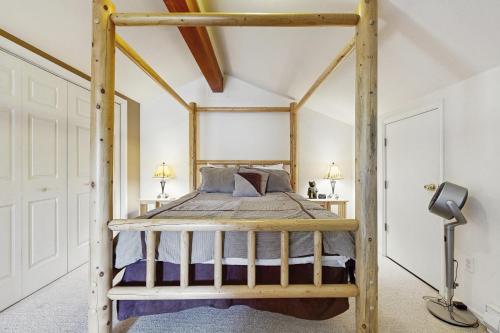 a bedroom with a wooden bunk bed in a room at Aspen Village Condo #32 in McCall
