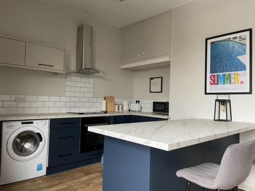 Η κουζίνα ή μικρή κουζίνα στο Comfy 1BD Retreat in the Heart of Alderley Edge