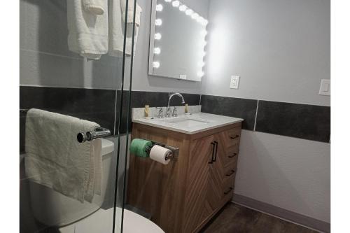 a bathroom with a sink and a shower at Marshall Lodge By OYO Hwy 65 in Marshall