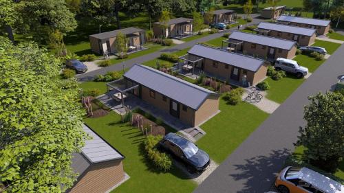 an overhead view of a house with cars parked in the yard at Veluwepark de Bosgraaf in Apeldoorn