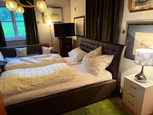 a bedroom with two beds with white pillows on it at Apartment Thomabauerhof in Oberzeiring